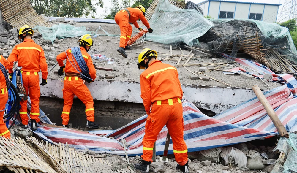 Emergency personnel clear debris after 2021 earthquake in Haiti