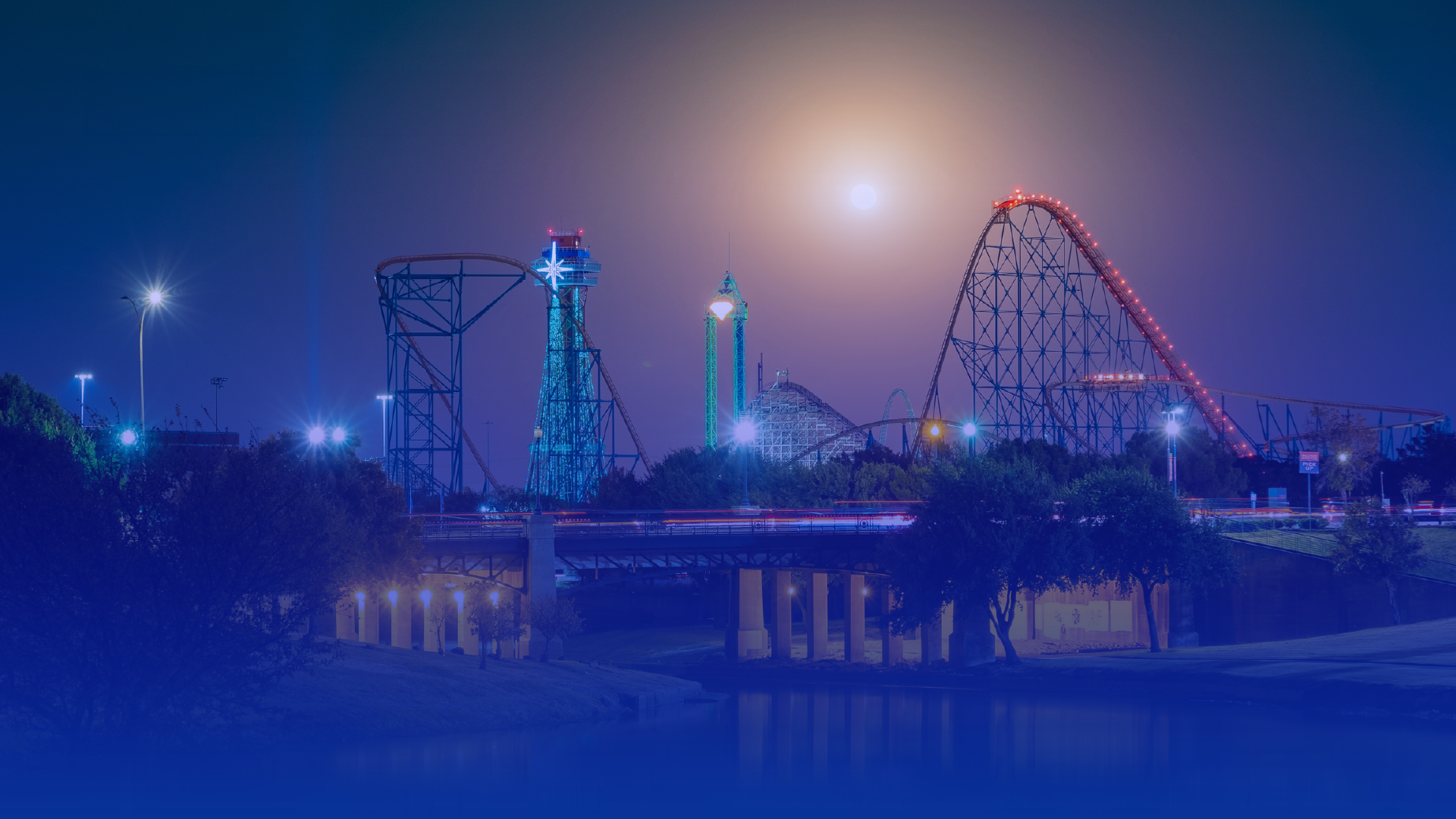 Hero image of an amusement park at night - regenAI